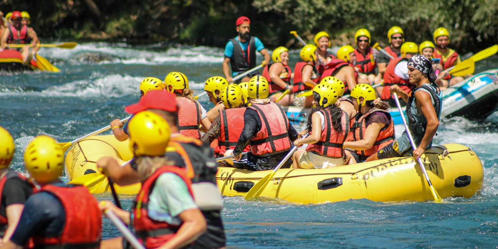A group enjoying an exhilarating rafting adventure on river rapids