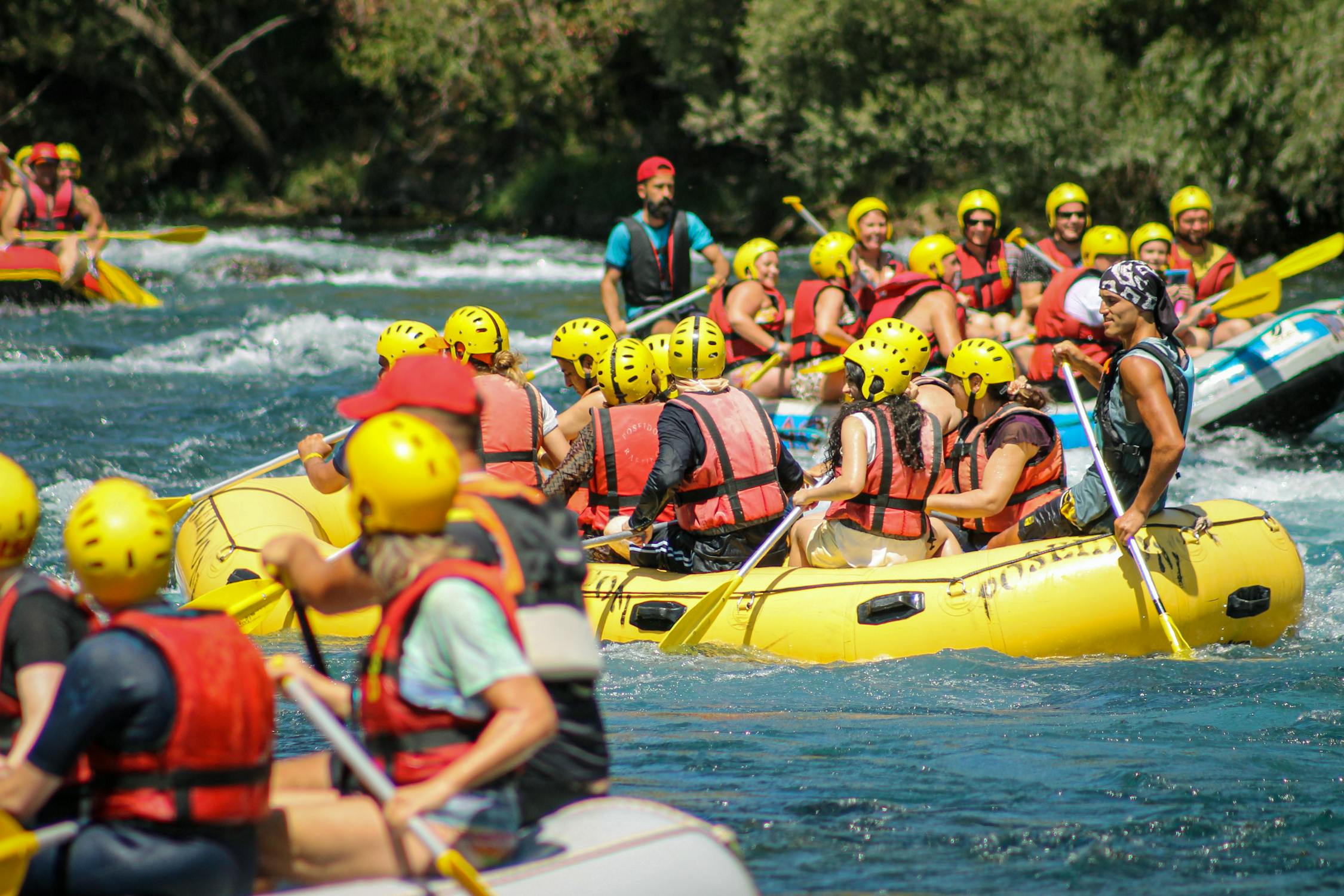 Group of People Riding Inflatable Rafts on Body of Water · Free Stock Photo