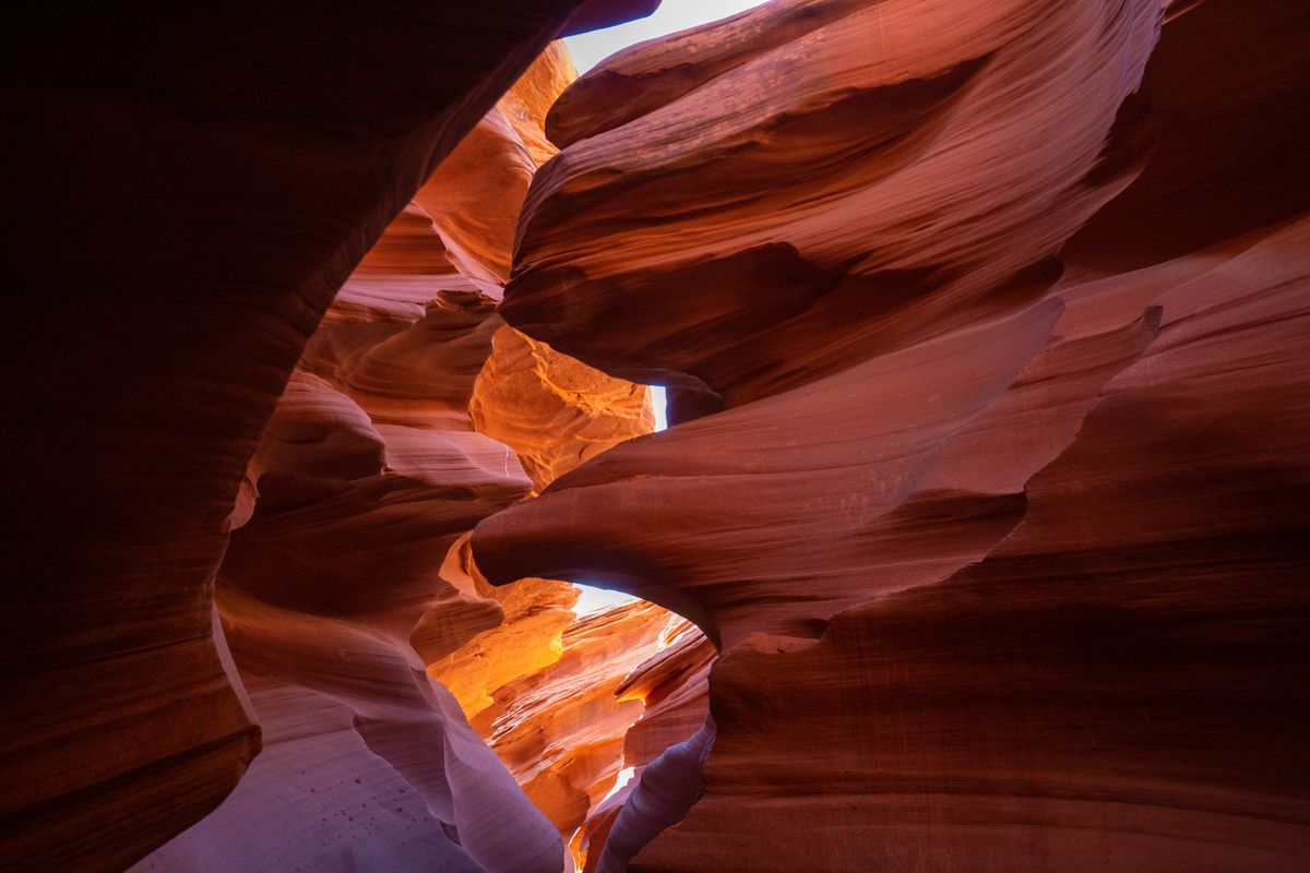 Sunlight streaming through the dramatic sandstone formations of Antelope Canyon