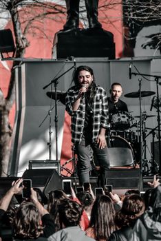 Live band performance in Antalya with a crowd enjoying the outdoor concert.