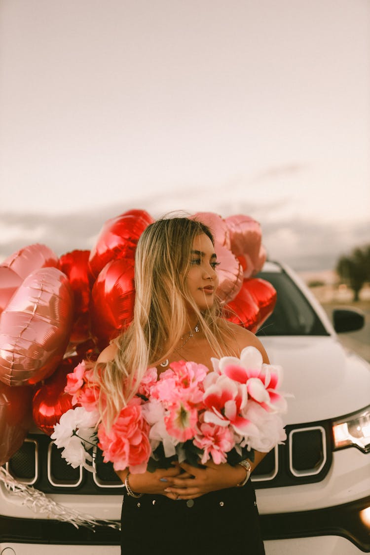 Woman With Flowers By Car