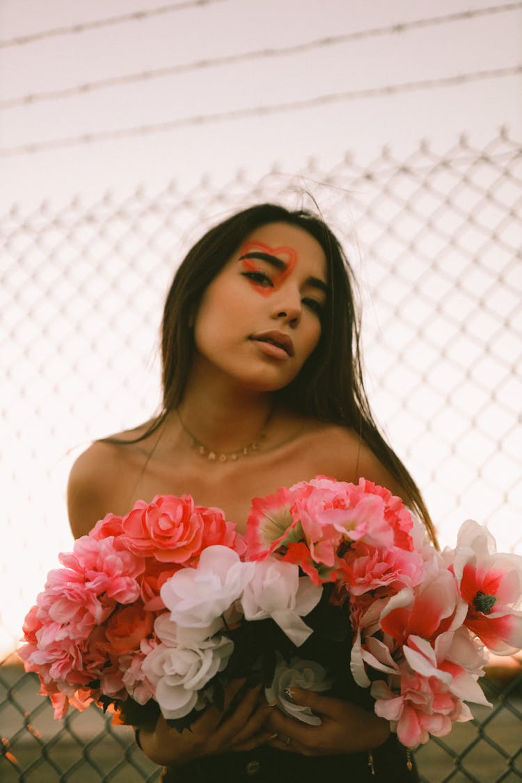 Woman With Flowers And Heart On Face