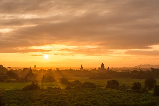 Stunning sunrise over Bagan's ancient pagodas in Myanmar, capturing the golden hour glow.