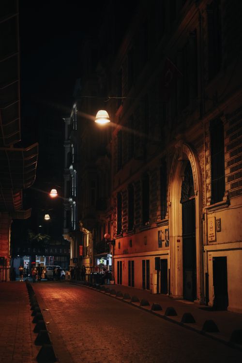 Free Explore Istanbul's historic architecture illuminated by street lights in this atmospheric nighttime scene. Stock Photo