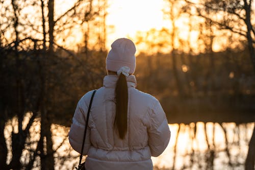 Woman in Puffer Jacket and Beanie Hat 