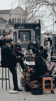 Traditional shoe polishing scene in Istanbul street, capturing daily life.
