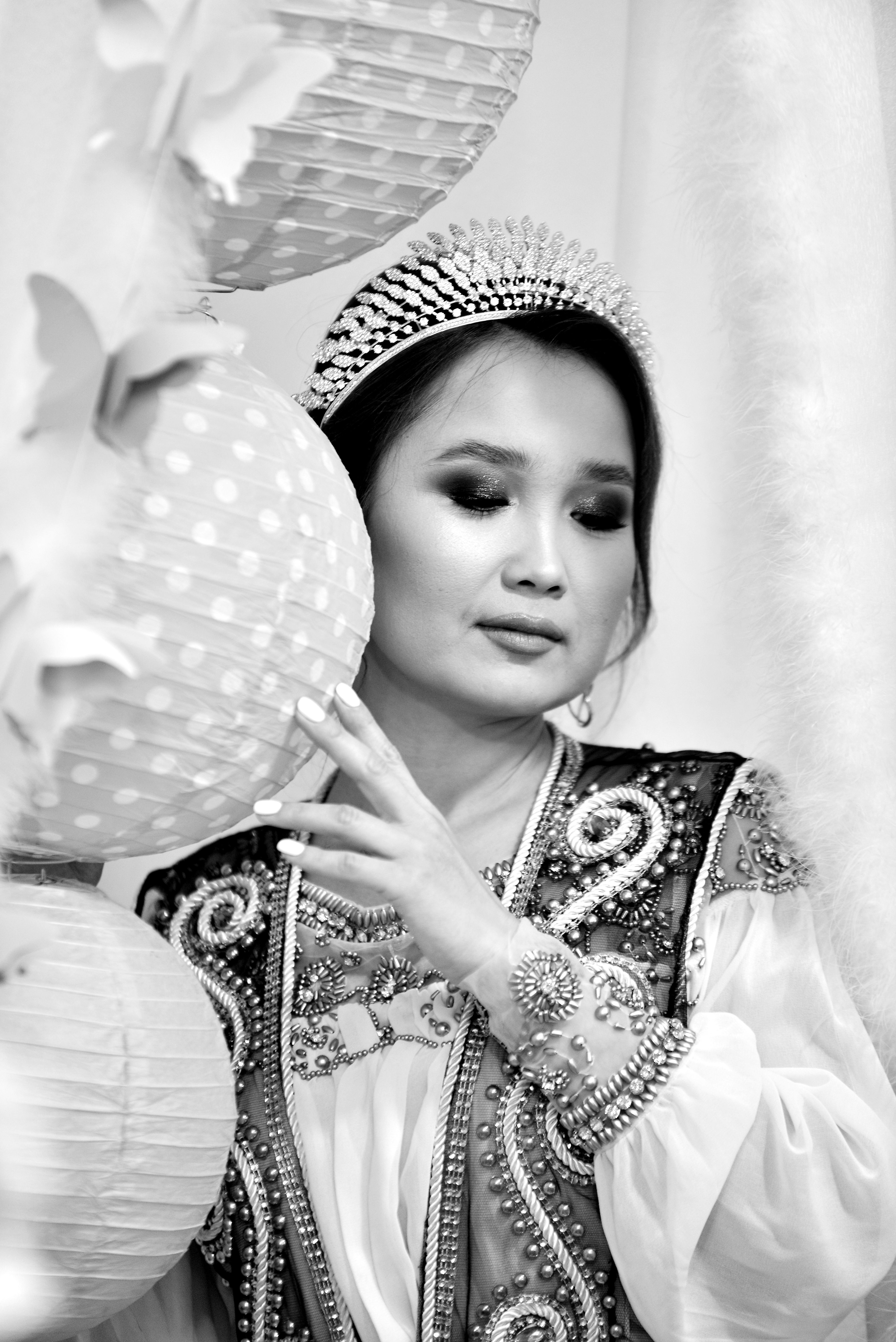 Elegant black and white portrait of an Asian woman in traditional wear and headdress.