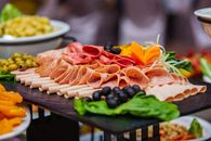 Sliced Meat With Sliced Vegetables on Brown Wooden Table