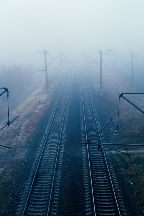 Free Grayscale Photo of Train Rail Stock Photo