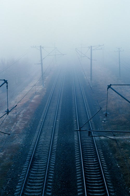 Photo of Train Tracks on a Foggy Day