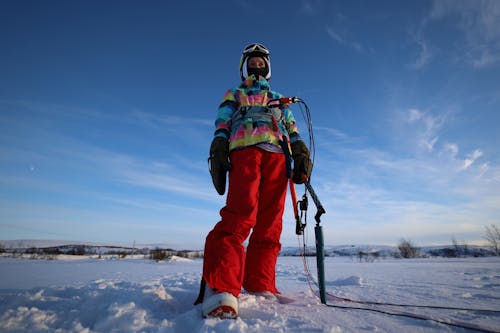 a Person Standing on Snow Covered Ground