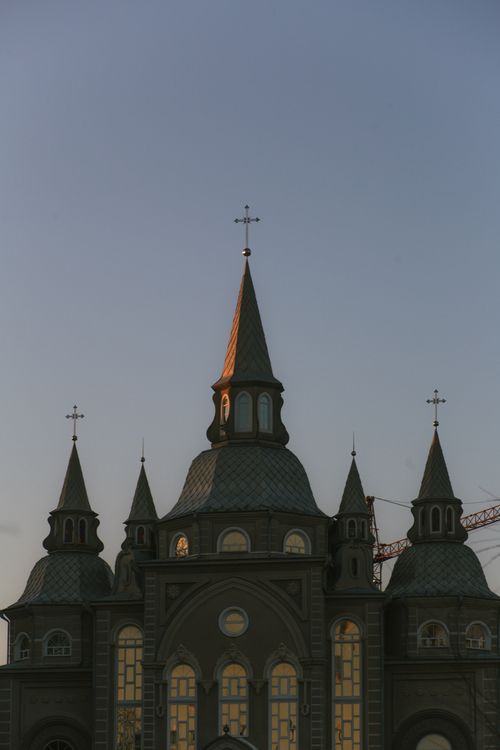 Free A captivating view of a gothic cathedral spire against a twilight sky. Stock Photo