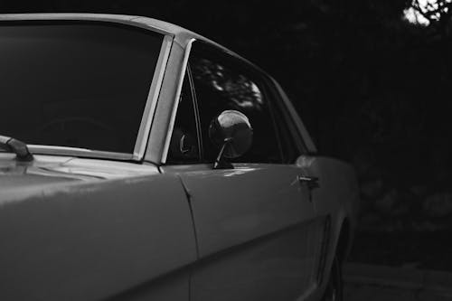
A Grayscale of a Vintage Car