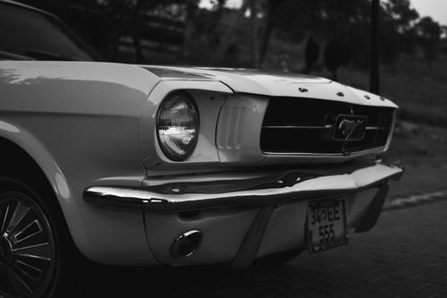 Free A classic Ford Mustang captured in grayscale, showcasing its iconic design. Stock Photo