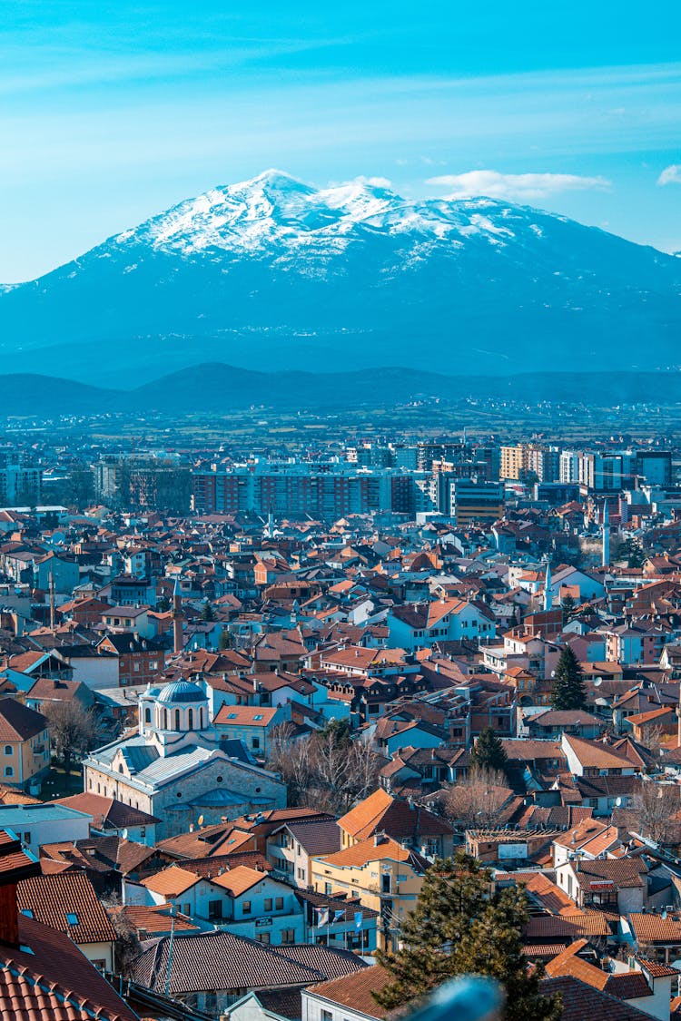 Aerial View Of City Near Mountain