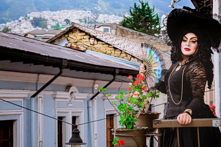 Woman In Black Victorian Dress Holding A Hand Fan