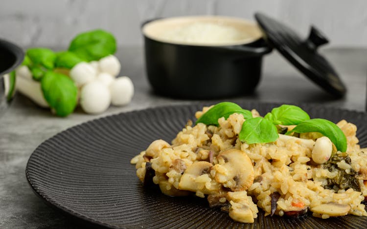 Risotto Dish On Black Round Plate