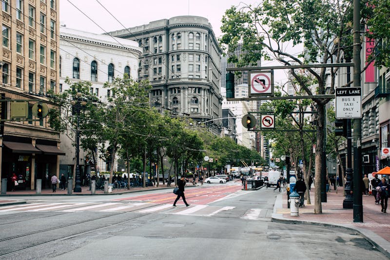 Pedestrians crossing a city street -- the kind of moment a fixed-lens camera captures best