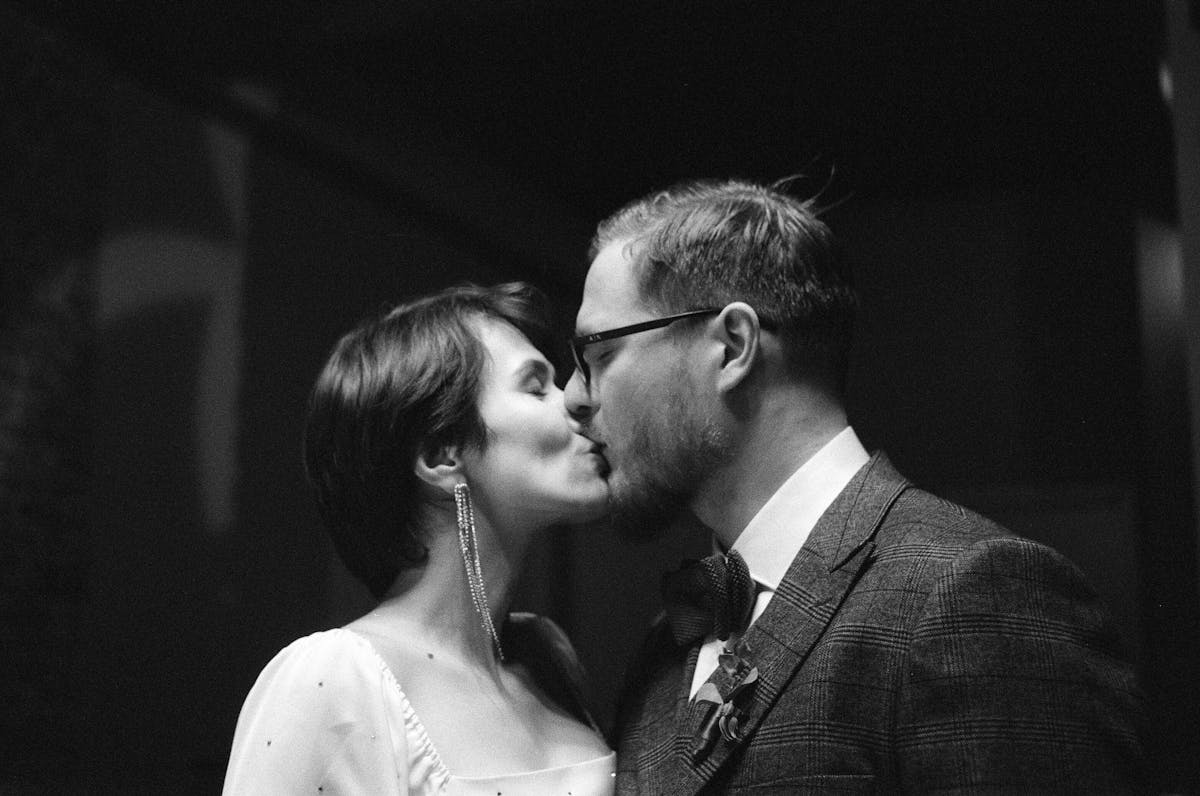 Two women footballers contesting a header during a match