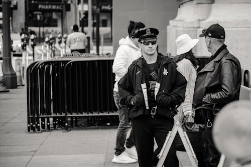 Free Man Wearing Jacket and Peaked Cap Grayscale Photo Stock Photo