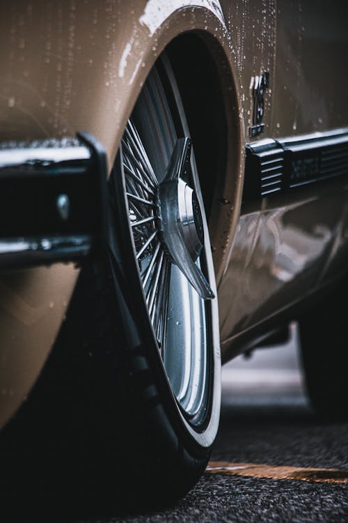 Brown and Black Car Parked on Concrete Floor