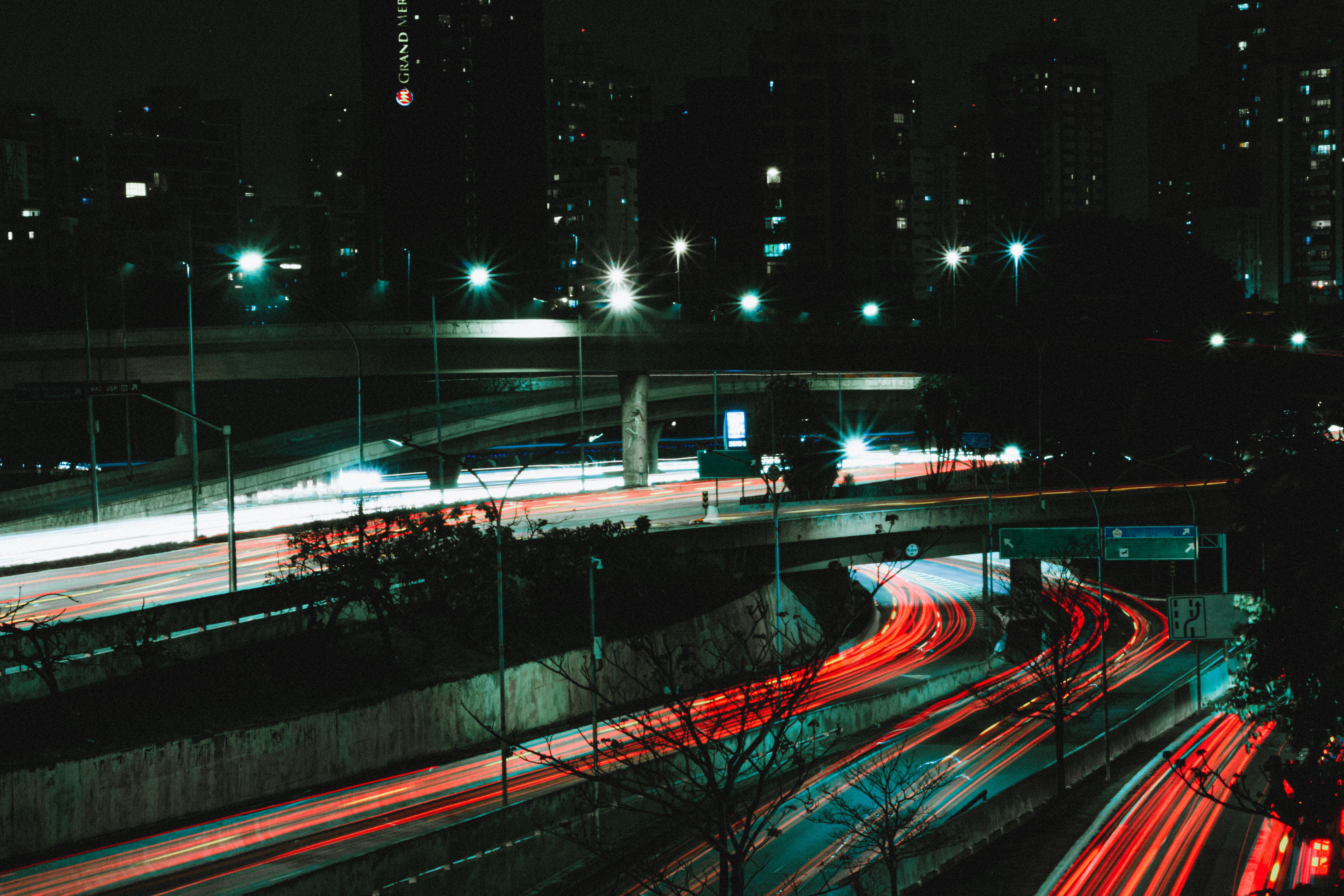 Long-exposure traffic light trails on a highway at night