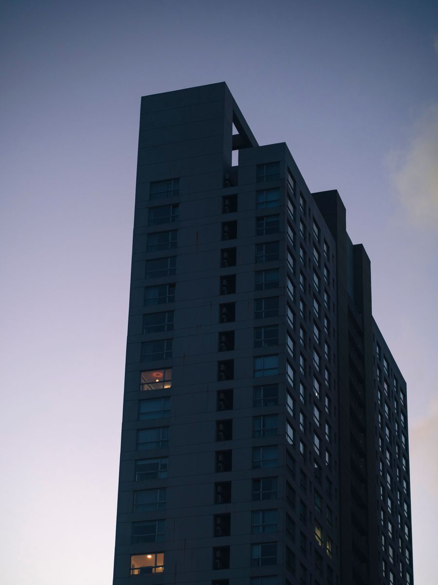 A tall residential tower against a twilight sky - photo by Mario Ame on Pexels