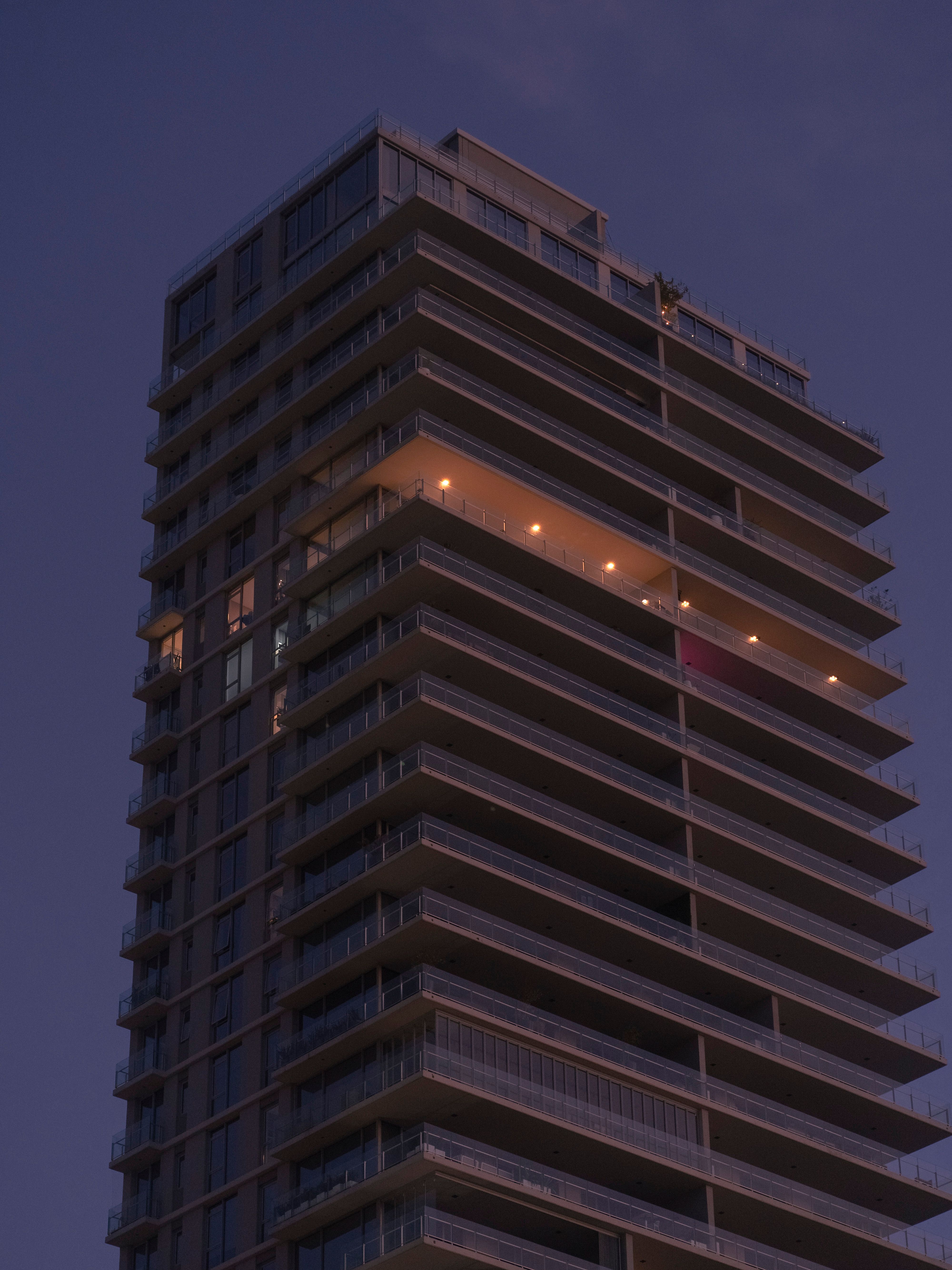 Brown Concrete Building during Night Time · Free Stock Photo