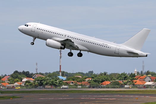 A commercial airplane lifts off from the runway, showcasing urban and rural backgrounds.