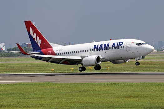 NAM Air Boeing 737 aircraft taking off from the runway during the day.