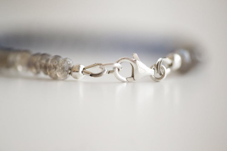 Silver Chain Link Bracelet In Close Up Photography