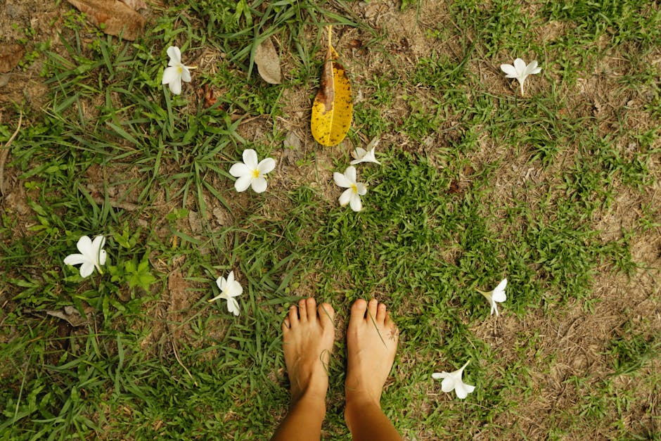 Feet firmly planted on the ground, symbolizing grounding - Somatic Exercises to Improve Your Mental Health Feet firmly planted on the ground, symbolizing grounding - Somatic Exercises to Improve Your Mental Health
