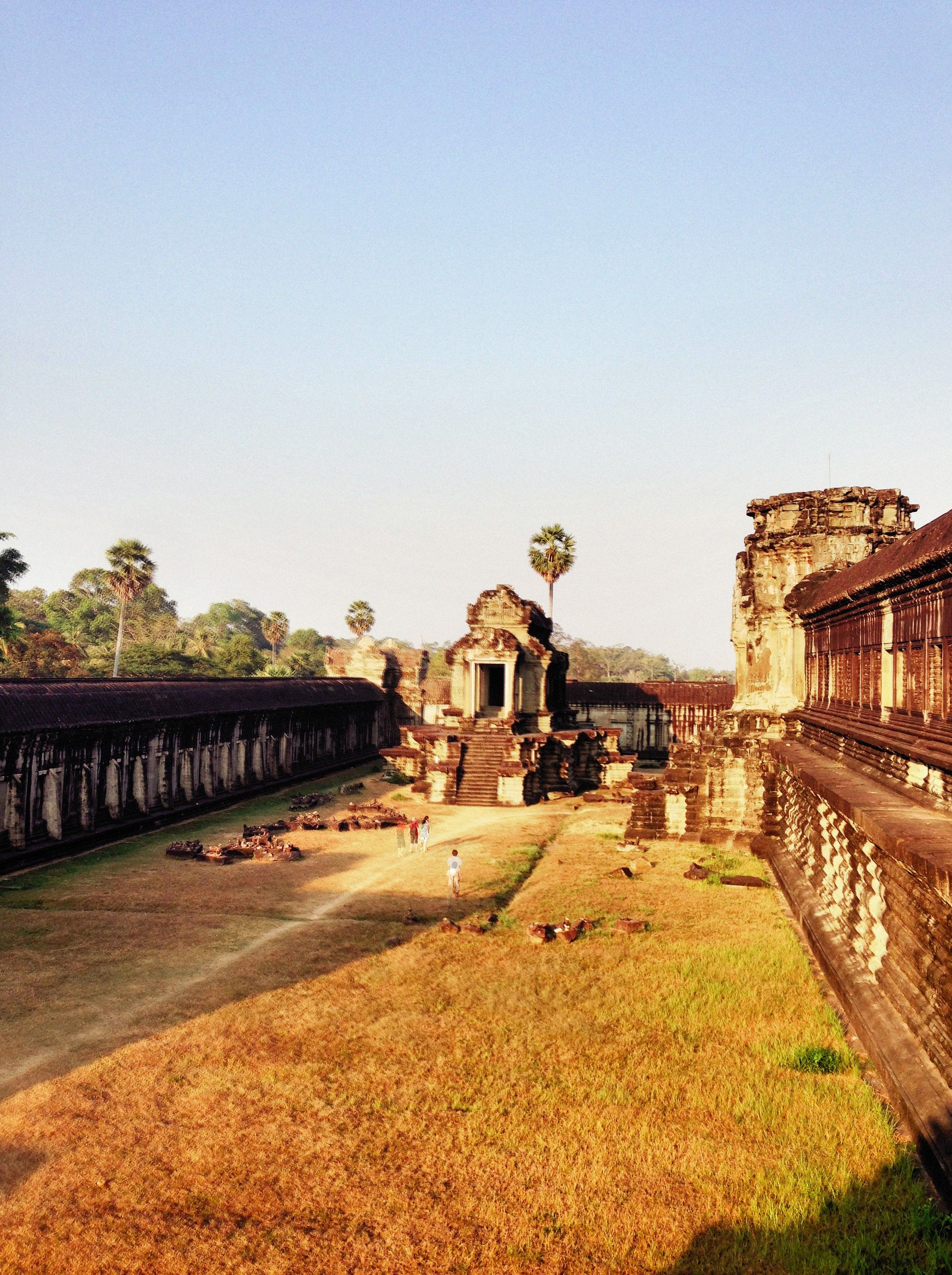 Angkor Wat temple ruins under a clear blue sky in Siem Reap, Cambodia