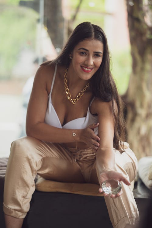 Brunette Woman Wearing Golden Necklace