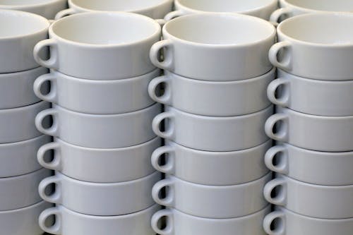 Stacks of White Ceramic Soup Caps