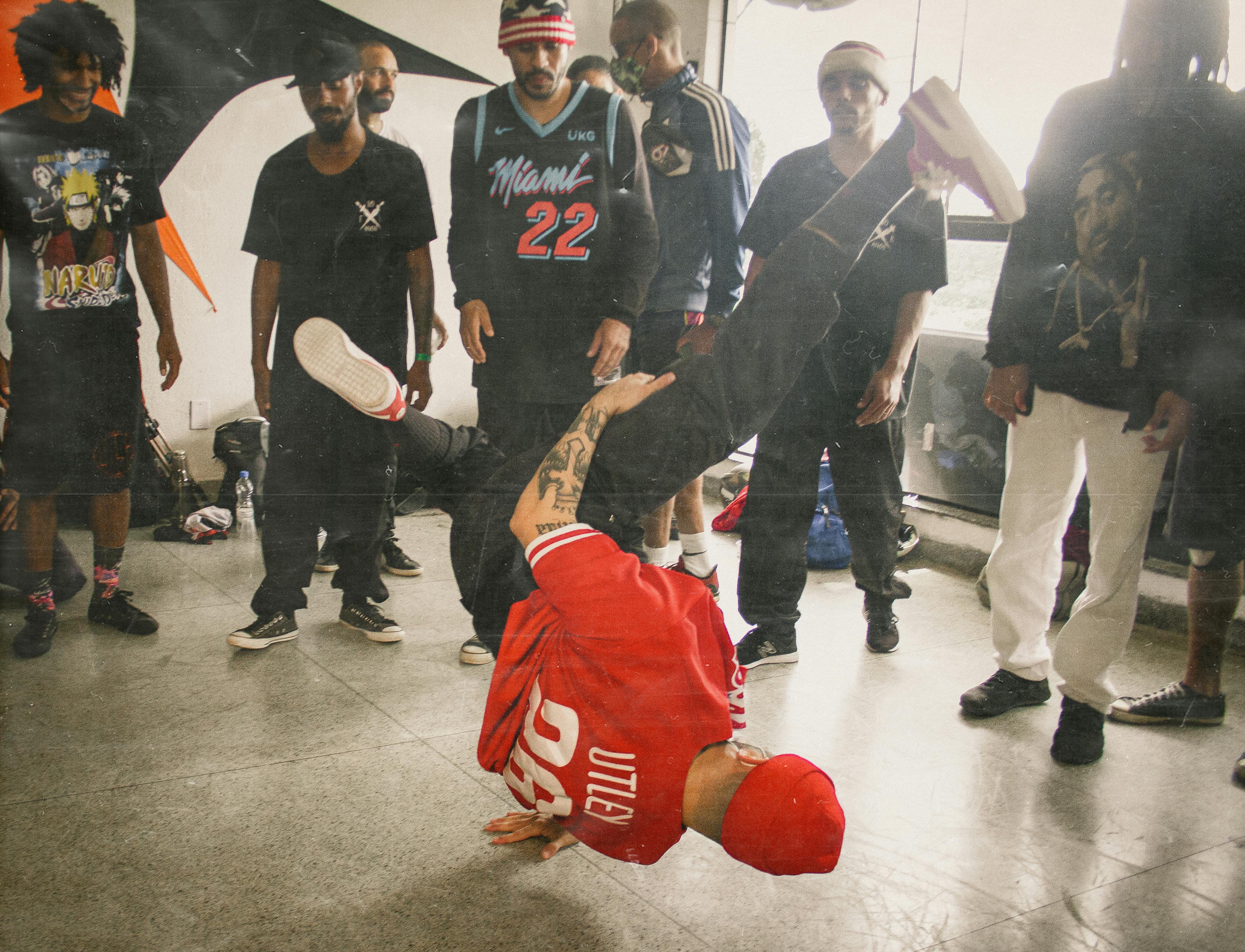 a man dancing on concrete floor