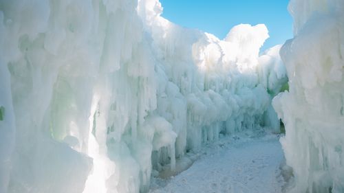 Free Explore intricate ice structures under a clear blue sky, capturing the essence of winter's beauty. Stock Photo