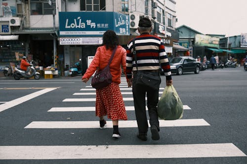 A Couple Walking on the Street