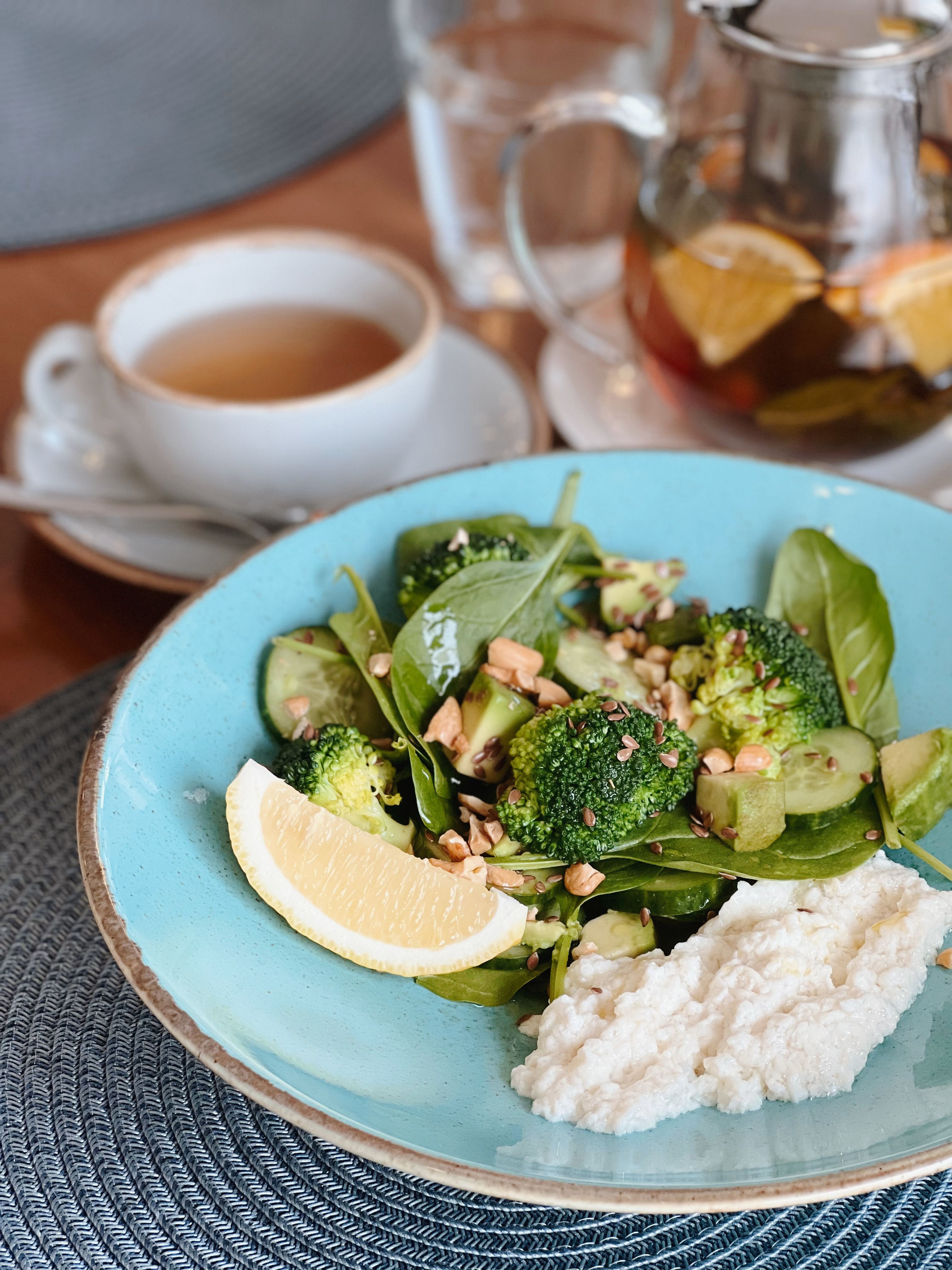 Delicious and nutritious vegetable salad served with a refreshing cup of tea.