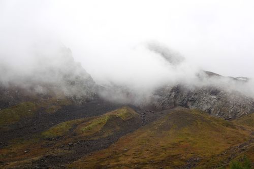 Free A mist-covered mountain range in North Ossetia, showcasing the rugged beauty of nature. Stock Photo
