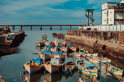 Wooden Boats Near the Bridge