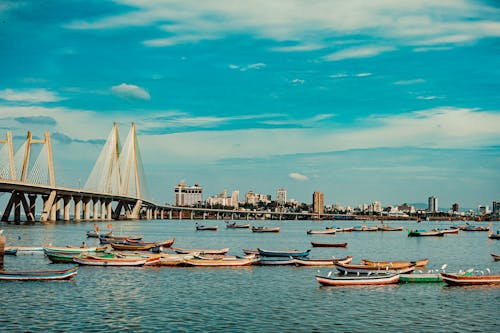 Free fishing boats near the docks with sea bridge  Stock Photo