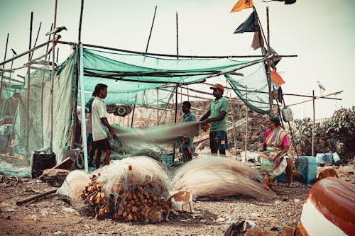 Free Fishermen folding the net Stock Photo