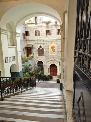 Stone courtyard seen from a covered stair hall, photo by Ezgi Arslanturk Karaman on Pexels