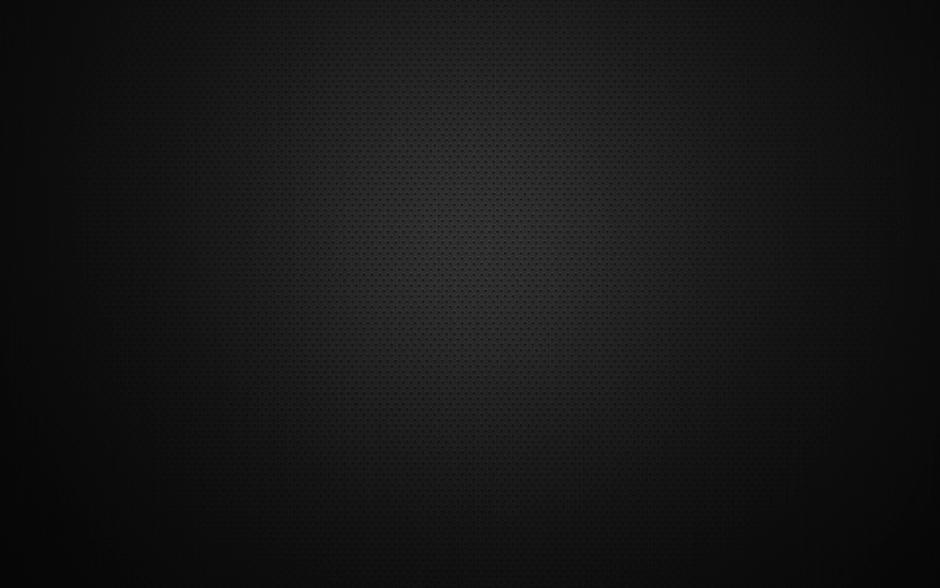 Black textured background featuring a subtle dotted pattern ideal for design purposes.