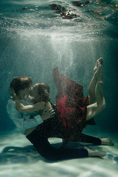 Free A Couple Dancing Underwater  Stock Photo