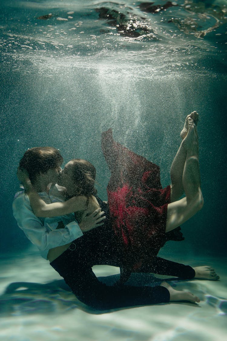 A Couple Dancing Underwater 