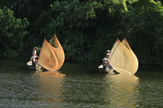 Men in Wooden Boats Fishing