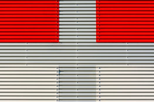 Abstract pattern with red and white corrugated metal for industrial design