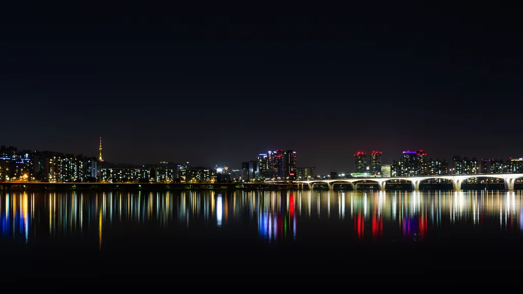 Seoul's illuminated skyline reflected in the Han River at night